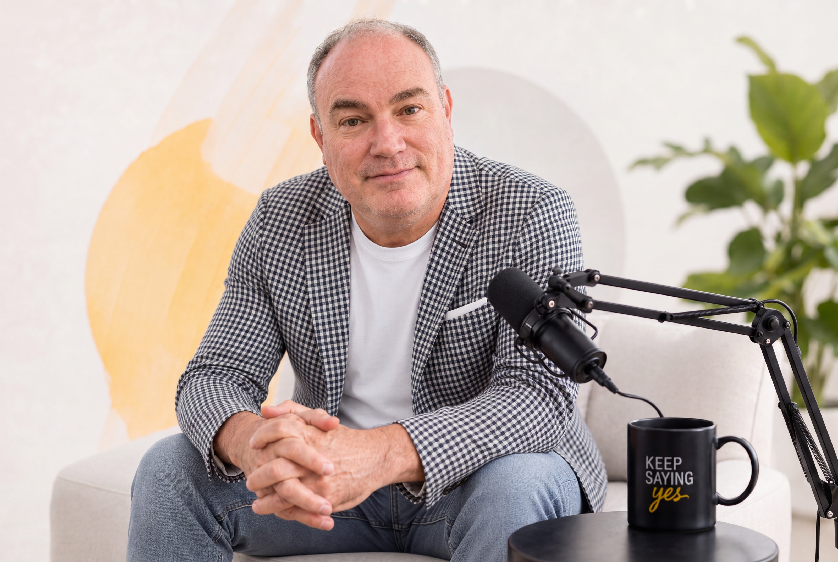 Chris Greer, host of Keep Saying Yes, at the microphone